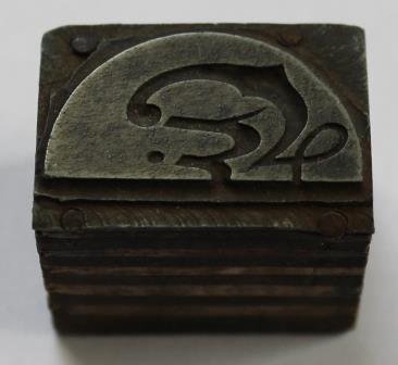 Oude brocante drukkerij matrijs stempel logo