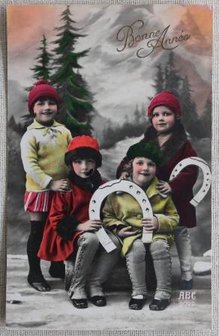 Antique vintage brocante Christmas postcard children with horseshoe, colored