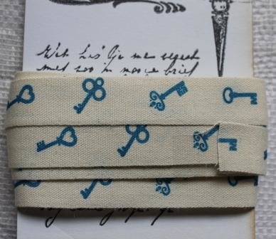 Fabric ribbon with blue keys on brocante haberdashery card