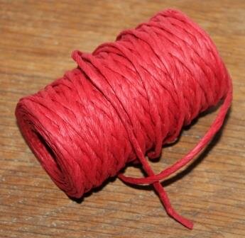 Vintage roll with decorative red raffia ribbon