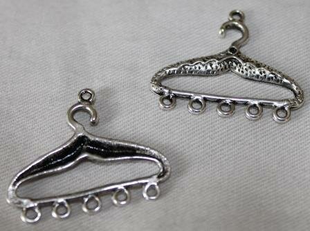Pendant clothes hanger, silver-colored connector, with eyelets