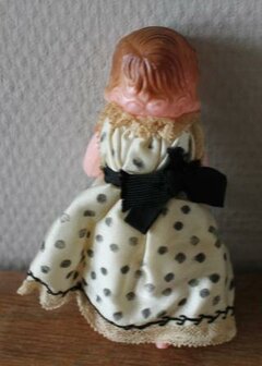 Old vintage brocante doll with satin polka dot dress