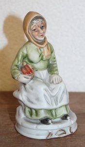 Brocante figurine of vintage old woman with scarf